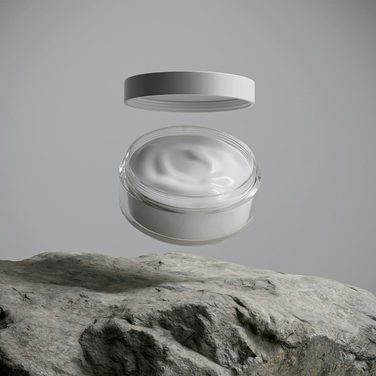 Jar of rich moisturising cream on a stone